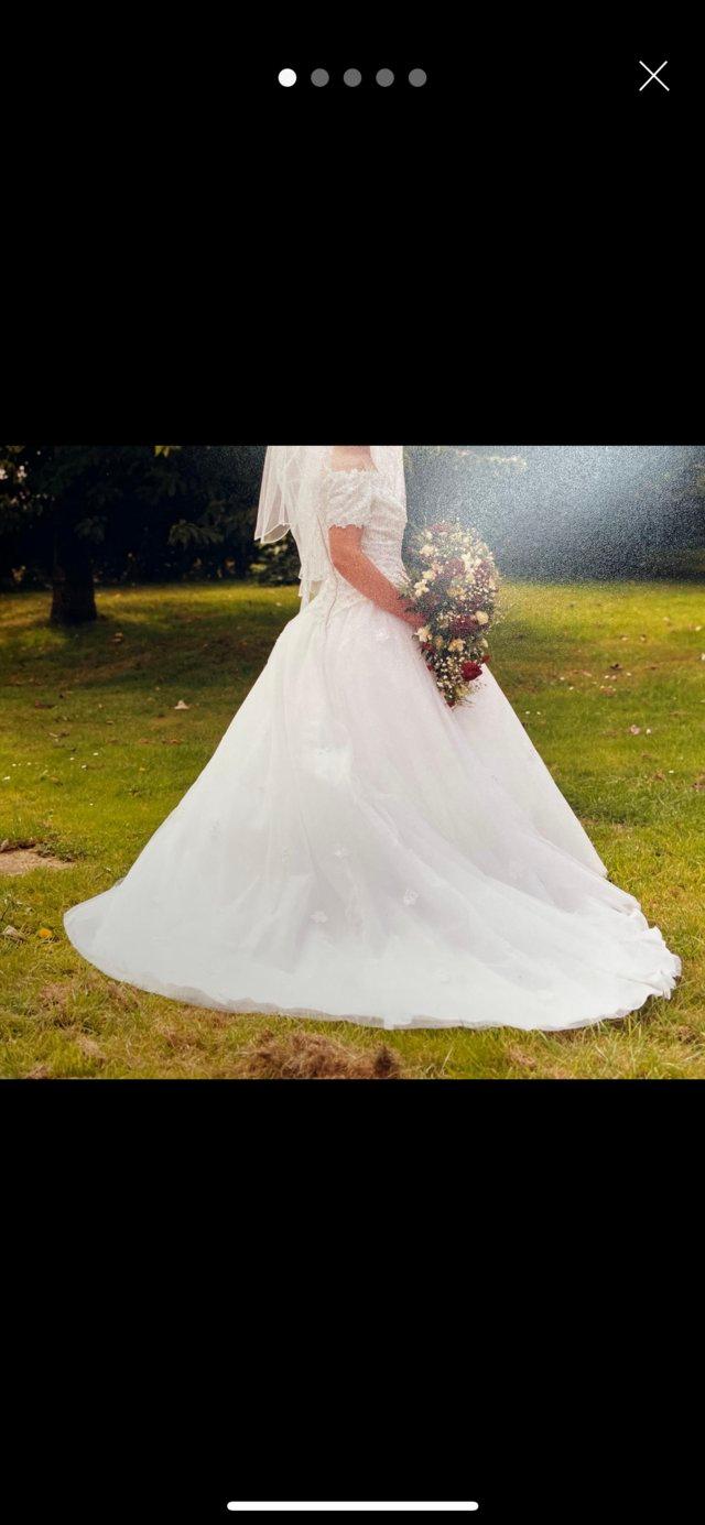 Preview of the first image of Wedding dress, good condition with no rips.