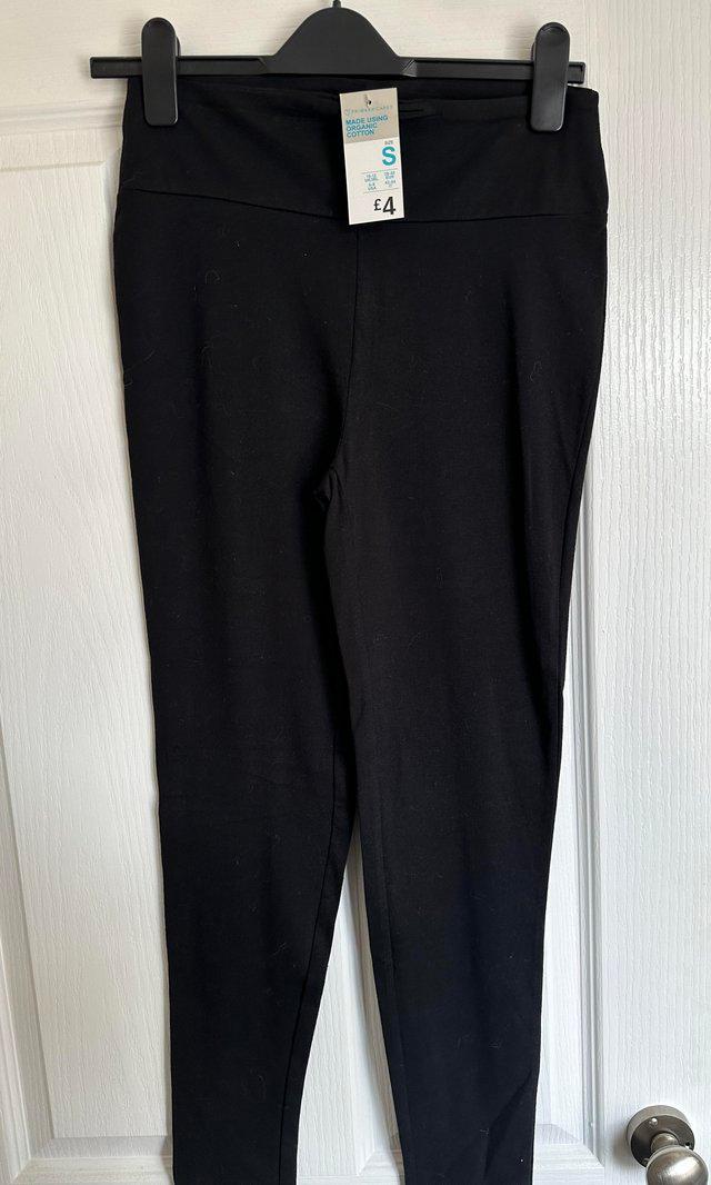 Preview of the first image of Brand New with tags black leggings.