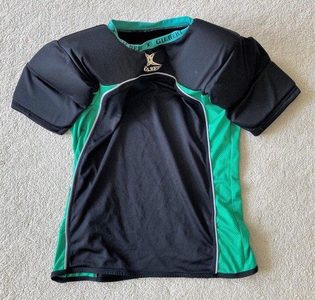 Preview of the first image of RUGBY GILBERT UNDER ARMOUR PADDED SHIRT ADULT SMALL PADS TOP.