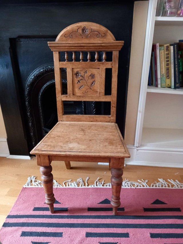 Preview of the first image of Antique oak carved wooden chair.