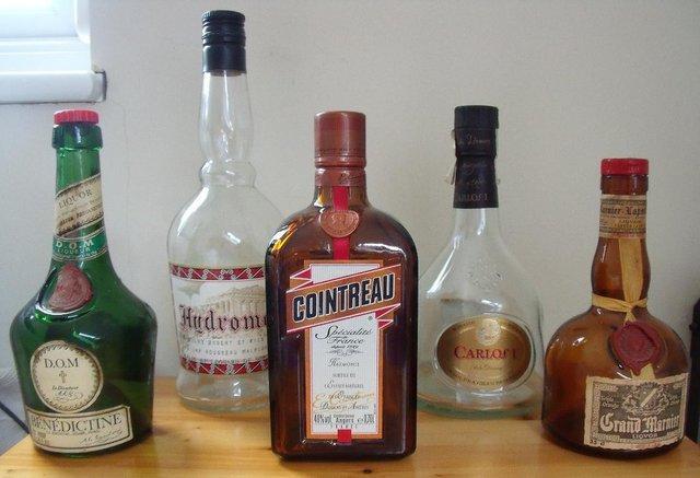 Preview of the first image of 4 Empty spirits bottles: Hydromel, Carlos I, Cointreau, etc..