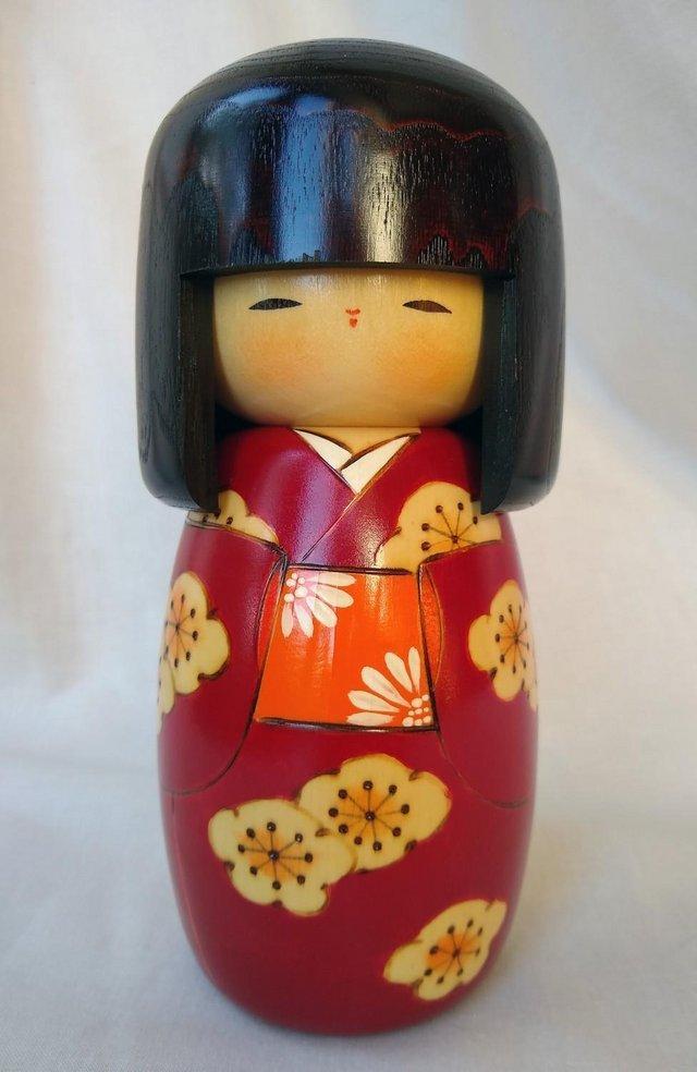 Preview of the first image of Red Kokeshi Japanese wooden friendship doll.