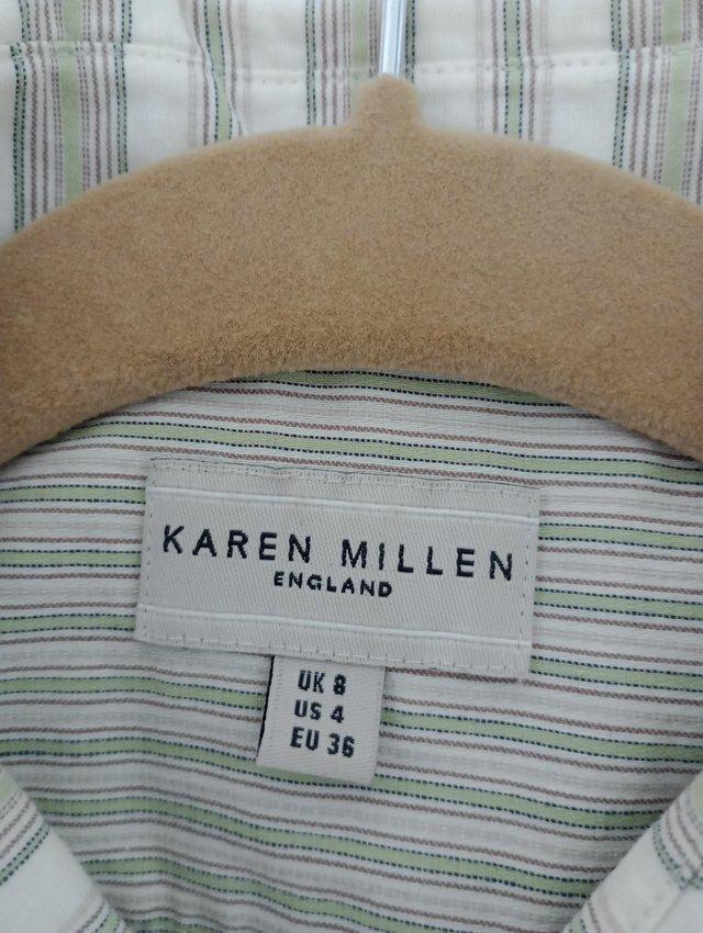 Preview of the first image of Ladies Karen Millen Green and White Blouse.