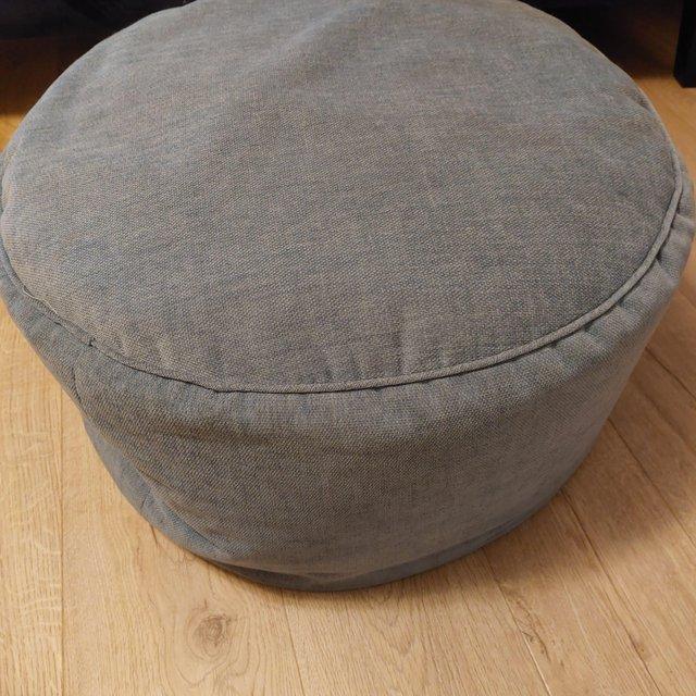 Preview of the first image of Next blue velvet round pouffe.