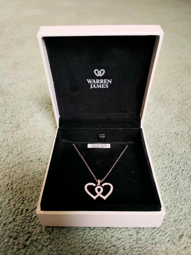 Preview of the first image of Warren James Entwined Heart Neckless.