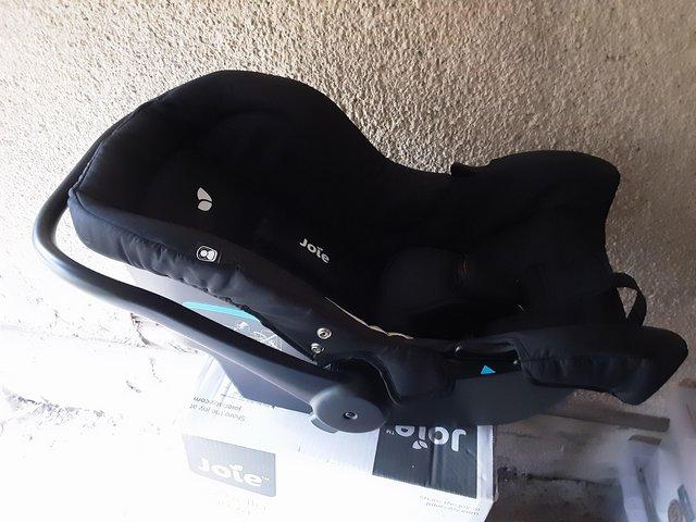 Preview of the first image of Joie Juva 0+ black car seat.