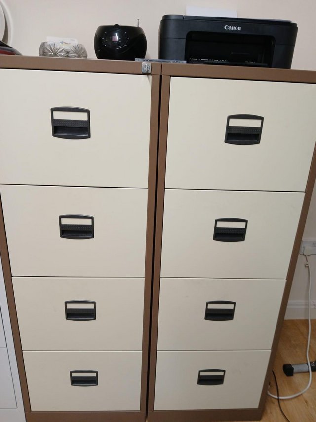 Preview of the first image of Two 4-Drawer Cream/Brown Filing Cabinets.
