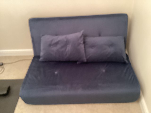 Preview of the first image of Next / Made 2 seater sofa bed in blue hardly used.