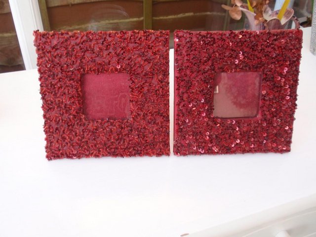 Preview of the first image of Two small red sequined photo frames.