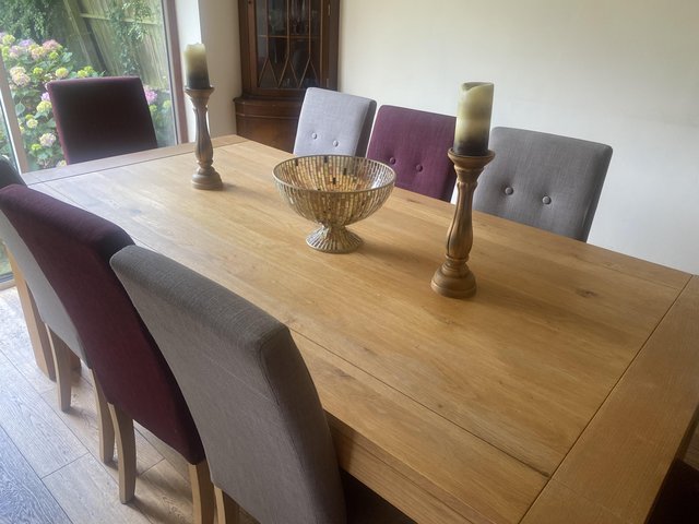 Preview of the first image of Lindos Dining Table & 4 Grey +  4 Red Lucy Chairs.