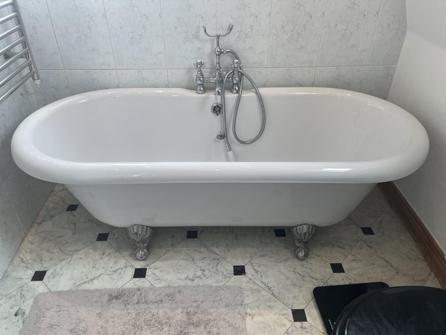 Preview of the first image of Roll top Bath withchrome taps and hand spray.