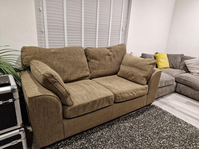 Preview of the first image of Two seater brown sofa, good condition.