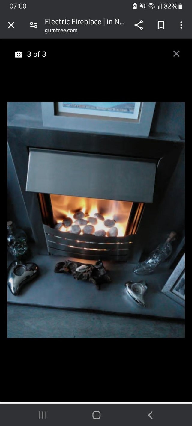 Preview of the first image of Electric Fireplace with grey surround.