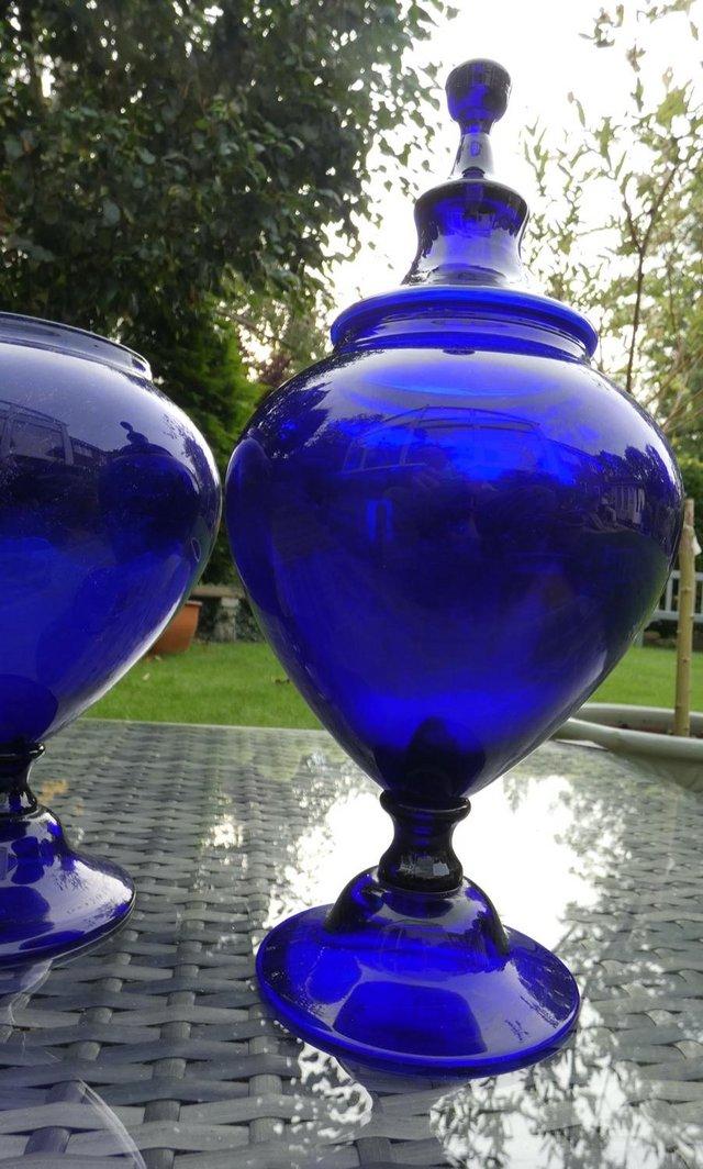 Preview of the first image of Two rich blue coloured display glass vases.