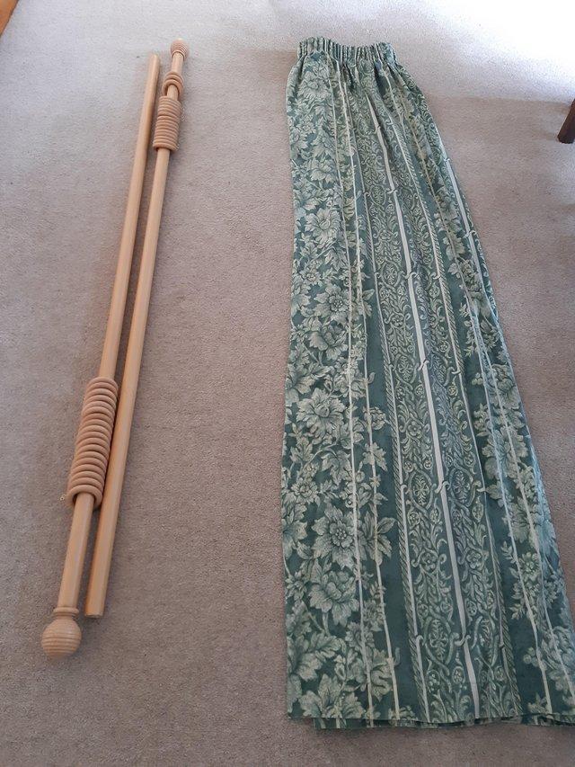 Preview of the first image of Wooden curtain pole and curtains.