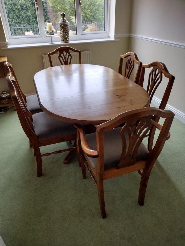 Preview of the first image of Ducal Antique Pine Table with six chairs.