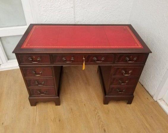 Image 1 of Beautiful ox blood leather and mahogany desk with cabinet.