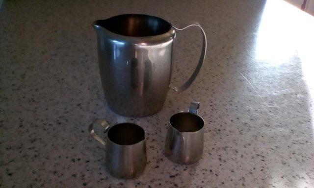 Preview of the first image of Vintage, 2 MINI Stainless Steel CREAMERS AND 1 MILK JUG.