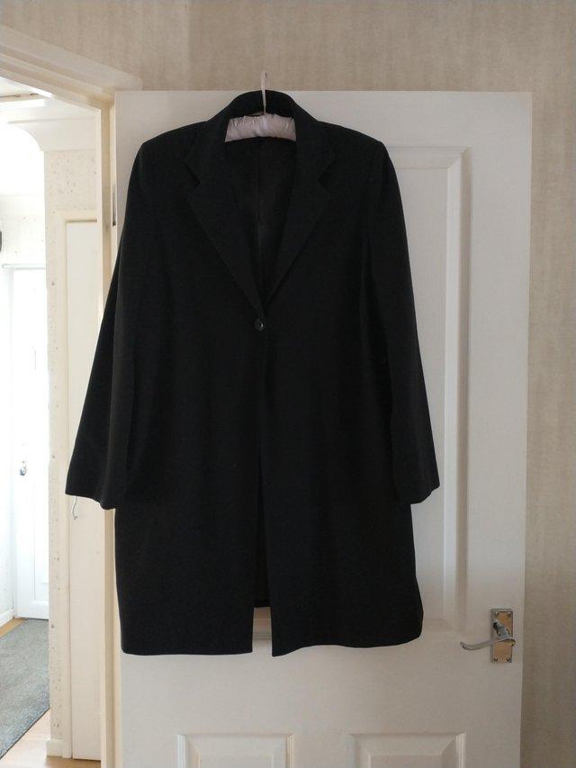 Preview of the first image of Women's dress coat. Black.lined.