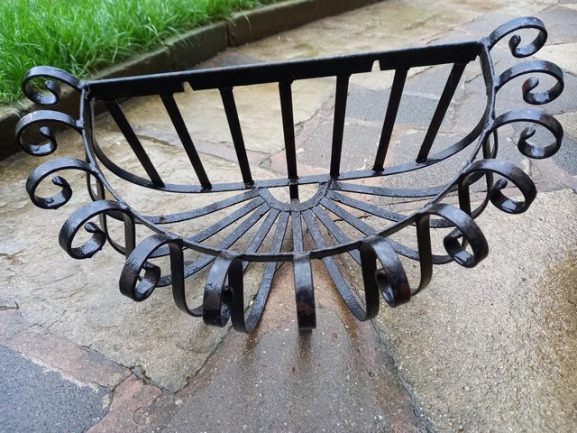 Preview of the first image of Cast Iron Vintage planter/ hay rack.