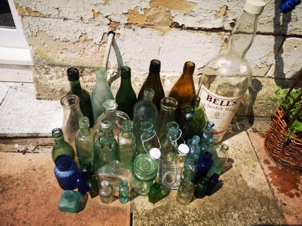 Image 1 of Old glass bottles, some with glass stoppers