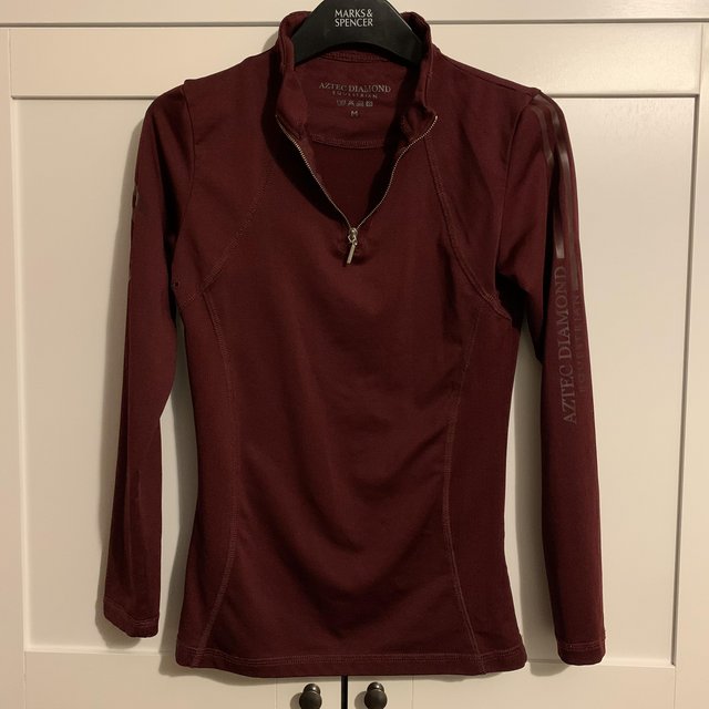 Preview of the first image of Aztec diamond equestrian burgundy base layer.