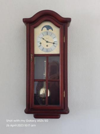 Image 1 of Wall clock. Mahogany finish working great