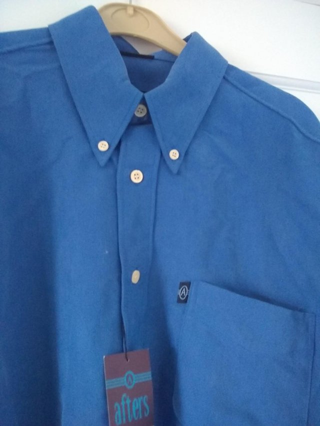 Preview of the first image of MAN'S VINTAGE, LONG SLEEVED SHIRT WITH LABEL, SIZE Medium.