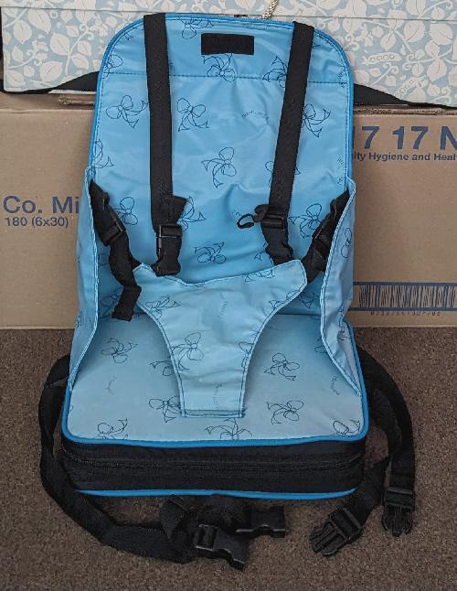 Preview of the first image of Mamiyam Black/Turquoise Portable Booster Seat.