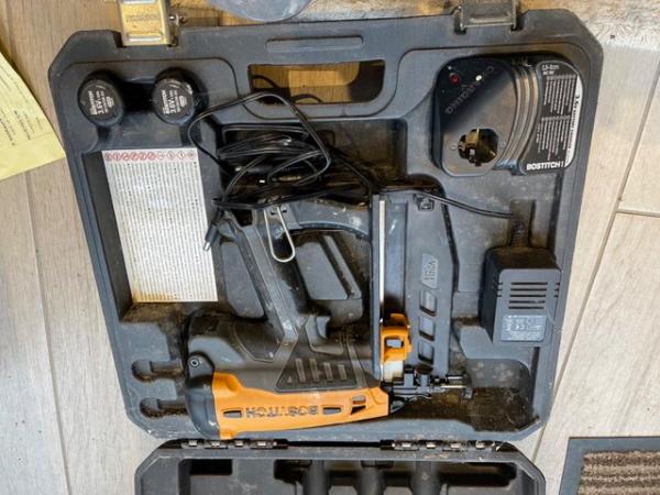 Image 3 of Bostich nail gun with charger.