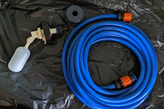 Preview of the first image of New mains water adaptor for Aquaroll with 7.5 metres of hose.