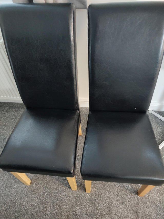 2 BLACK HIGH BACK SKIRTED DINNING CHAIRS WITH OAK LEGS £70 — photo 2 of 2