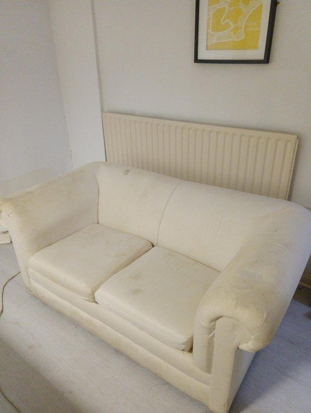 Preview of the first image of 2 seat sofa with cream covers..