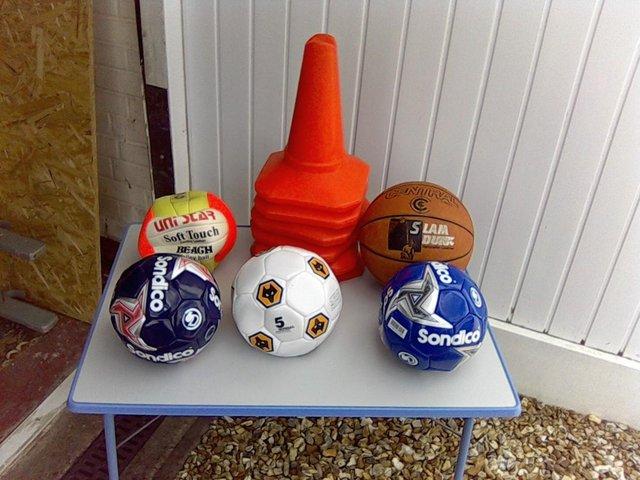 Preview of the first image of For sale set of 1 football, 1 beach ball, 1 basketball.