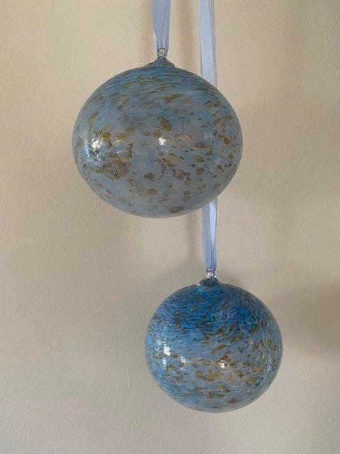 Preview of the first image of 2 New Glass Decorative baubles.