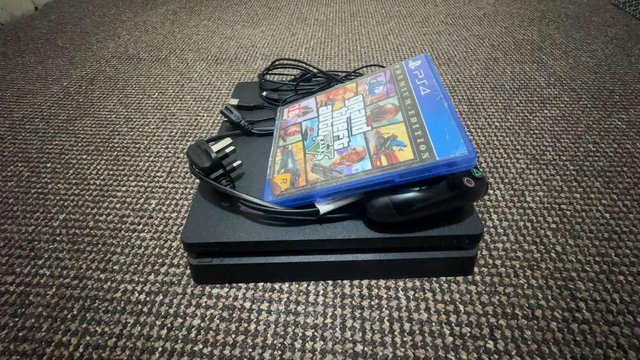 Preview of the first image of LIKE NEW PS4 SLIM 500GB WITH GAME AND NEW CONTROLLER.