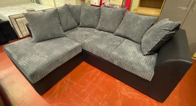 Preview of the first image of Byron scatter back corner sofa in black snake/grey jumbocord.