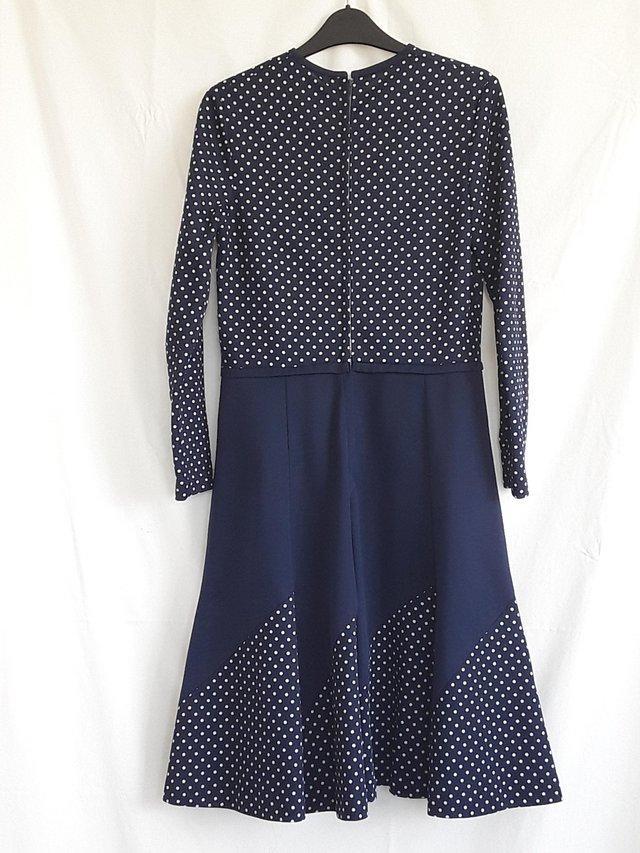 Preview of the first image of LADIES DRESS CIRCA 1970'S COLOUR DARK BLUE WITH POLKADOTS.