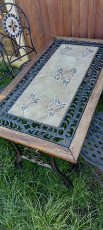 Image 1 of Heavy cast iron table and 4x chairs