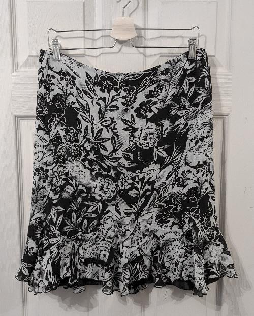 Preview of the first image of Ladies Black & Grey Flowered Silk Skirt - Size XXL.
