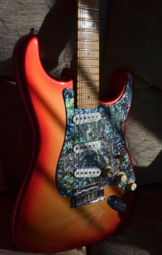 Preview of the first image of Fender American Strat Deluxe - Sunset + Abalone Scratchplate.