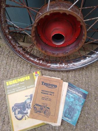 Image 3 of Triumph Twenty One front wheel and books.