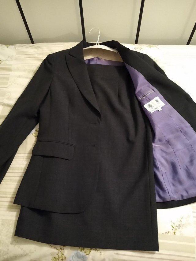 Preview of the first image of Austin Reed grey suit, size 6 skirt, size 8 jacket.