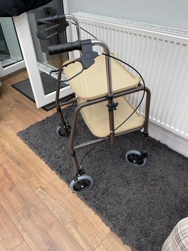 Preview of the first image of Care & Co height adjustable trolley.