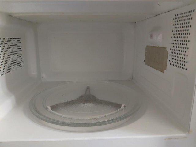 Preview of the first image of Grey Sharp Microwave fairly used.