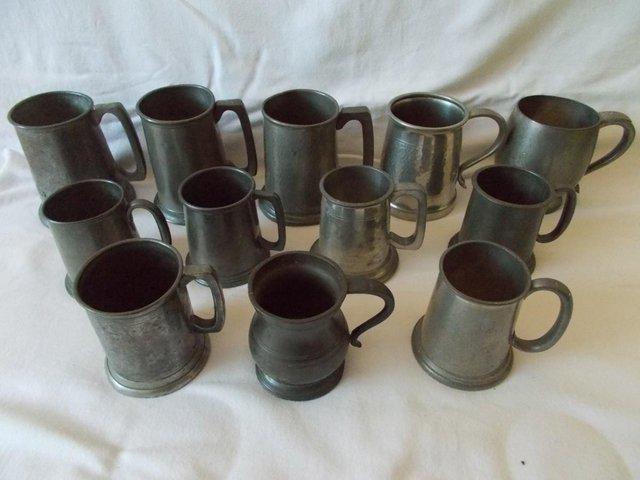 Preview of the first image of 12 English Pewter Tankards various sizes.