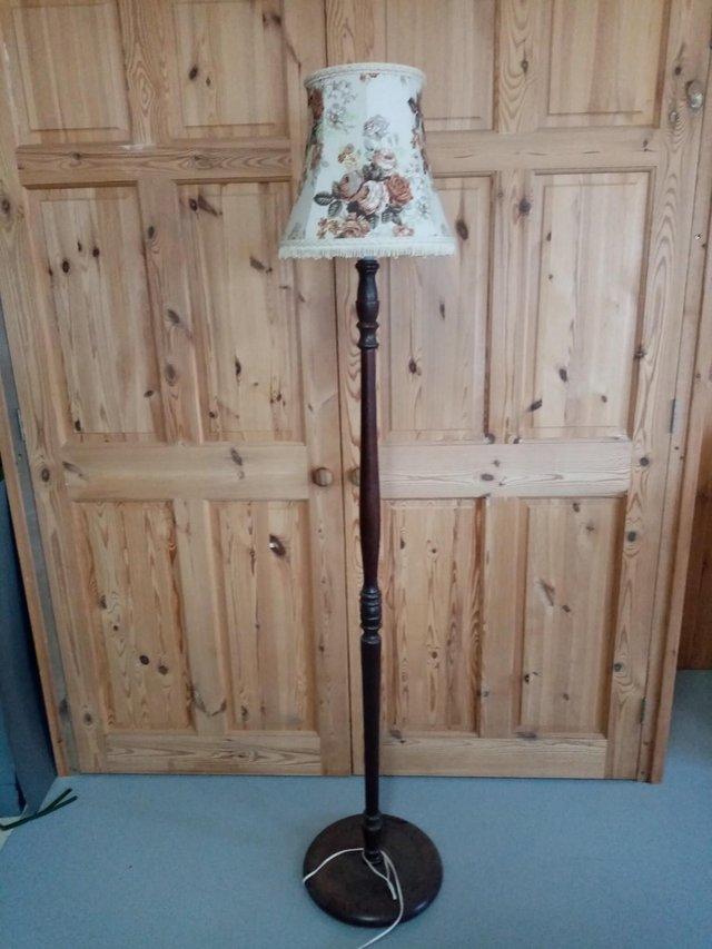 Preview of the first image of wooden lamp stand with round basefor sale.