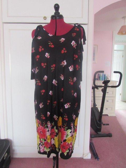 Preview of the first image of George Size 20 Black floral print cold shoulder dress.