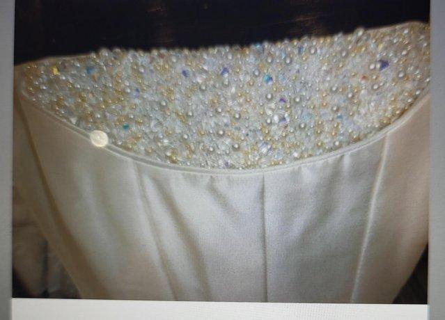 Preview of the first image of Brand new designer wedding gown.
