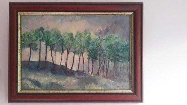 Preview of the first image of Original oil painting: Stormy Light behind the Pine Trees.